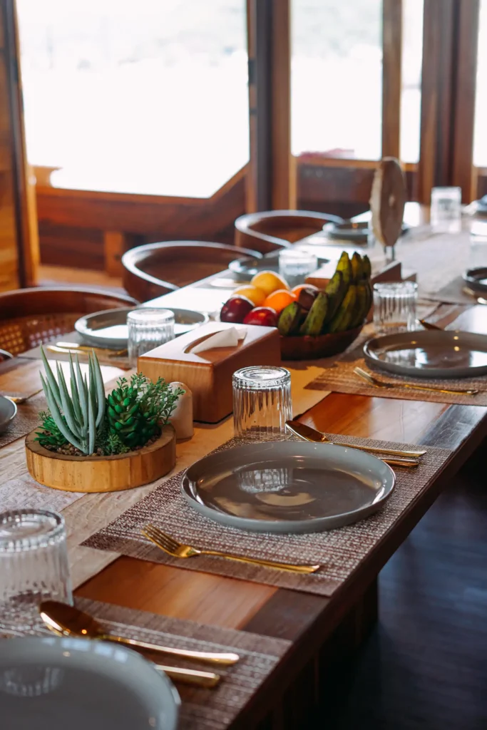Interior dining and lounge space on board the Angelica phinisi liveaboard