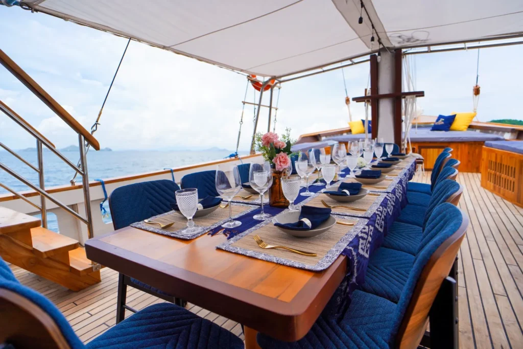 Outdoor dining table aboard LaMain Voyage I