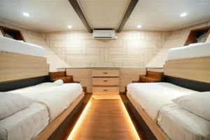 Four single beds in the Kelimutu sharing cabin aboard Mosalaki