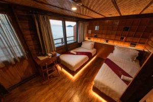 Upper deck twin cabin with balcony access aboard Neomi Cruise