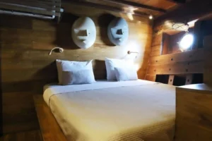 Double cabin in antique teak aboard Tiare Cruise