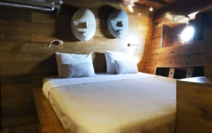 Double cabin finished in antique teak aboard Tiare Cruise