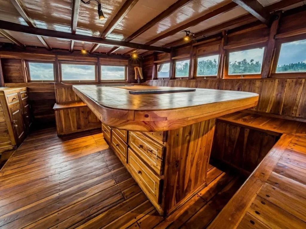 Panoramic wooden dining area aboard Akomo Isseki