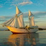 Alexa 31-metre phinisi sailing at sunset in Indonesia