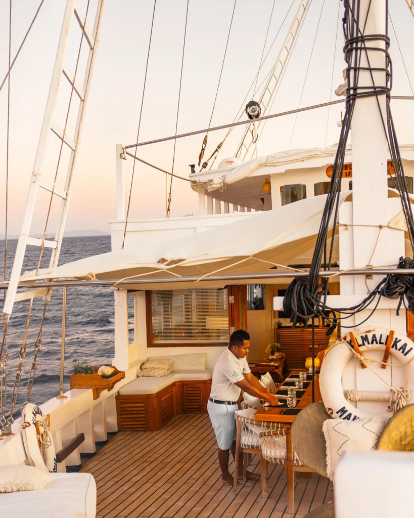 Covered outdoor dining area on the main deck of Aliikai Voyage