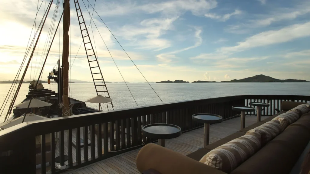 Shaded lounge seating on the main deck of Alila Purnama