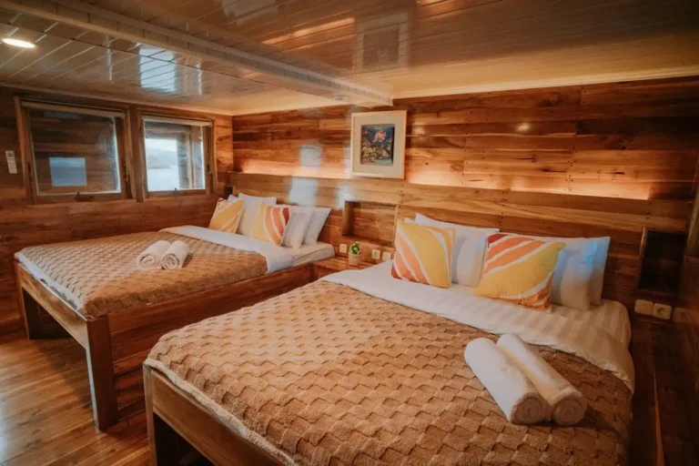 Upper deck cabin 1 with two double beds aboard Alore