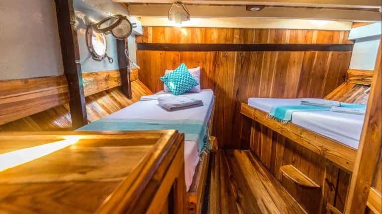Family cabin with one double and one single bed aboard Amalia Komodo