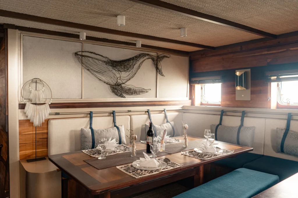 Indoor dining table aboard Amaya Explorer