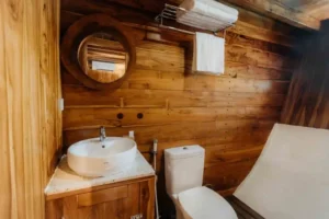 Wood-finished ensuite bathroom aboard Andamari