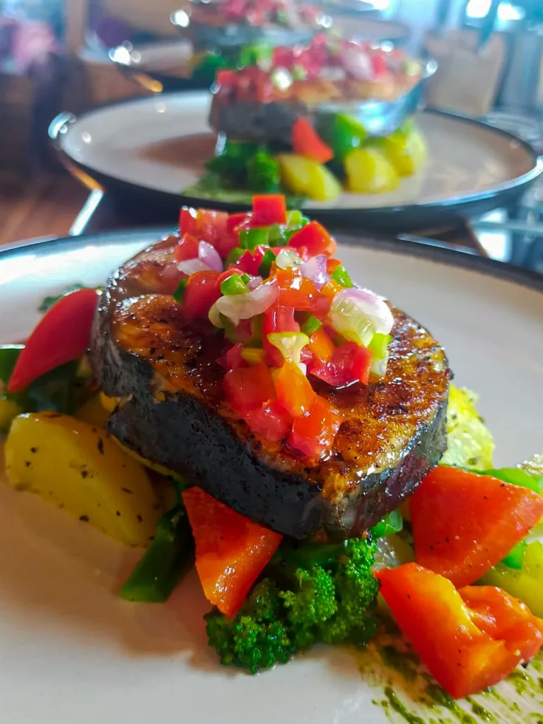 Mahi-mahi with vegetables prepared aboard Anne Bonny
