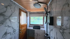 Private bathroom in the Deluxe Panoramic cabin aboard Arfisyana 2