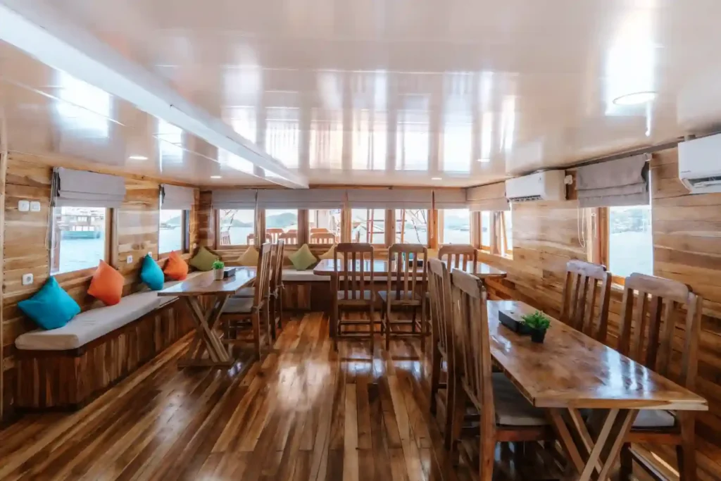 Interior dining area aboard Baraka phinisi