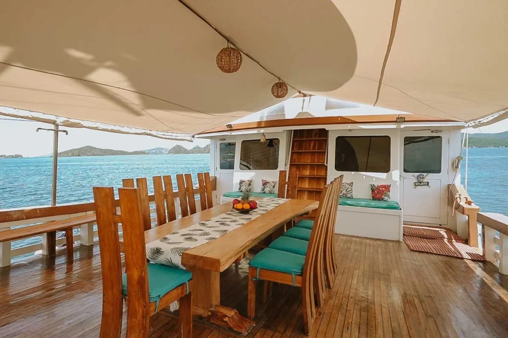 Outdoor dining table aboard Cajoma IV phinisi