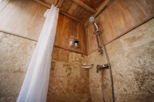 Hot and cold shower area in a Cajoma IV ensuite bathroom
