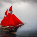 Calico Jack phinisi under its red sails