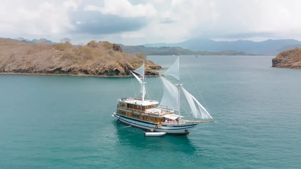 Aerial view of the Catnazse phinisi liveaboard anchored in Komodo National Park