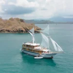 Aerial view of the Catnazse phinisi liveaboard anchored in Komodo National Park