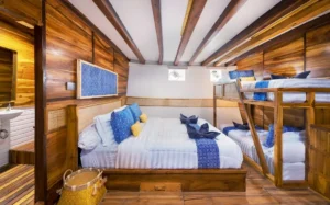 Grandis 3 and 4 cabin on Catnazse showing the queen bed and two bunk beds