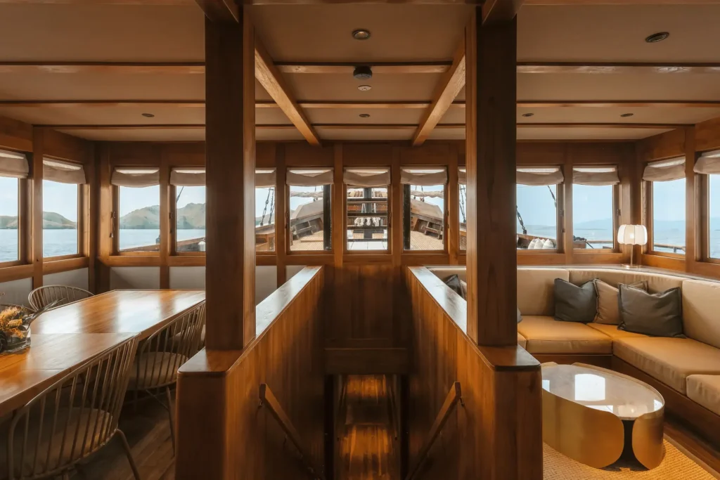 Communal lounge space with ocean views on the Celestia phinisi yacht