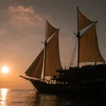 The Celestia phinisi yacht under sail in Komodo National Park, Indonesia