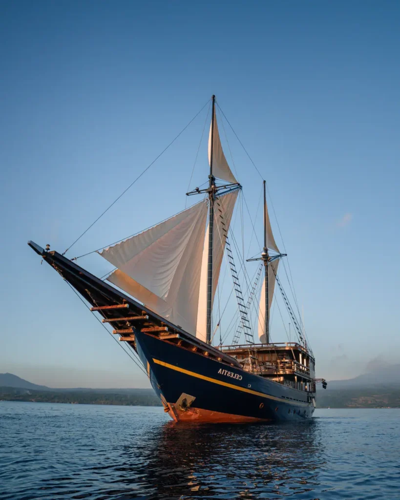 Second exterior view of the Celestia phinisi yacht at anchor