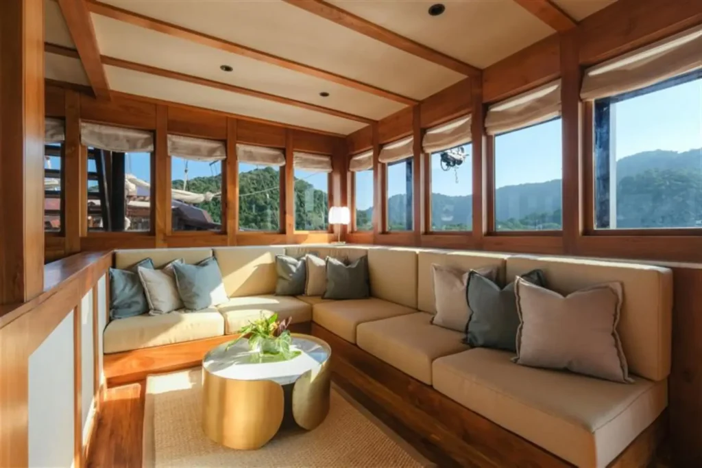 Custom furnished seating in the interior of the Celestia phinisi yacht