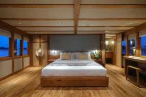 Wide view of the Celestia Master Stateroom with king bed and panoramic windows