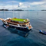 Chakana (Indo Master) phinisi liveaboard at anchor with dive tender