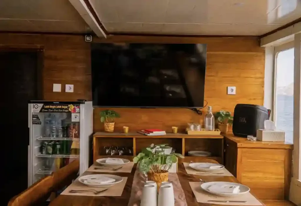 Dining area seating on Chrisbow Azure, air-conditioned and open to the deck