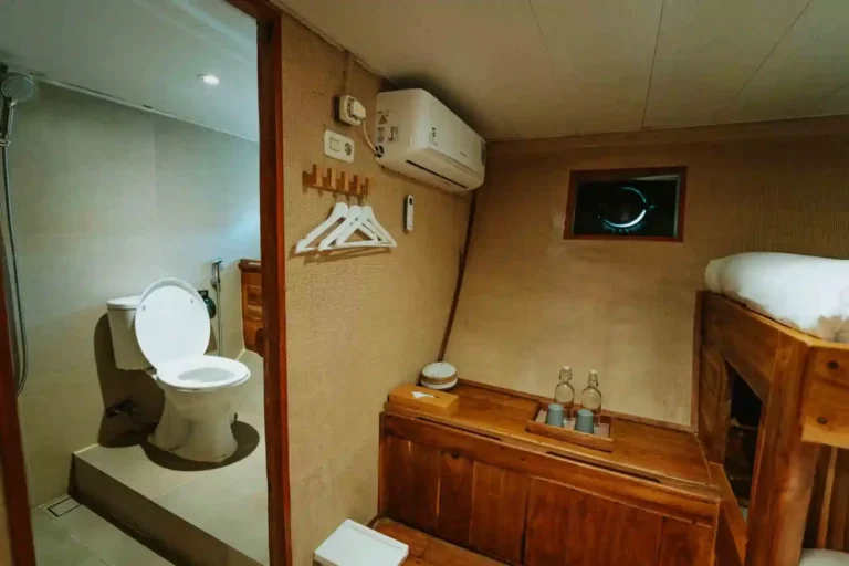Double bed in a guest cabin aboard Cordelia