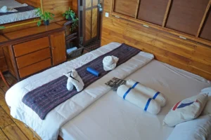 Queen bed in the Intsia cabin aboard EcoXplorer