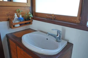 Intsia Master Cabin bathroom sink and sea-view window on EcoXplorer