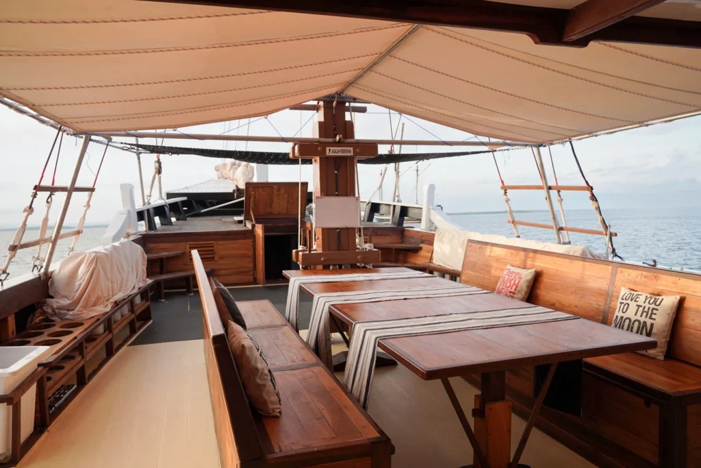 Covered outdoor lounge and gathering area aboard EcoXplorer