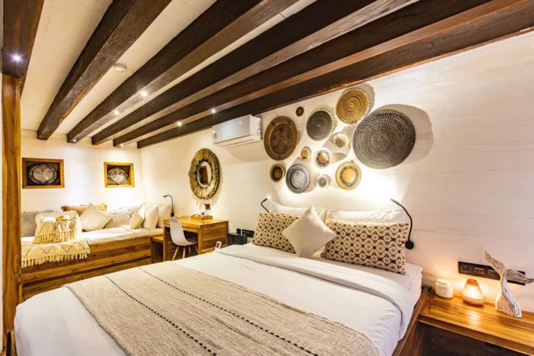 Master suite with a double bed and additional single bed aboard Fenides