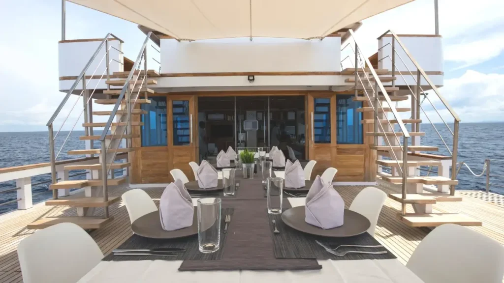 Outdoor dining area aboard Fenides liveaboard