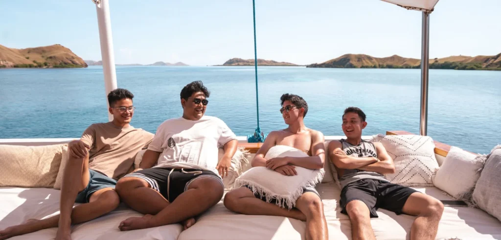 Guests in the outdoor lounge aboard Fenides liveaboard