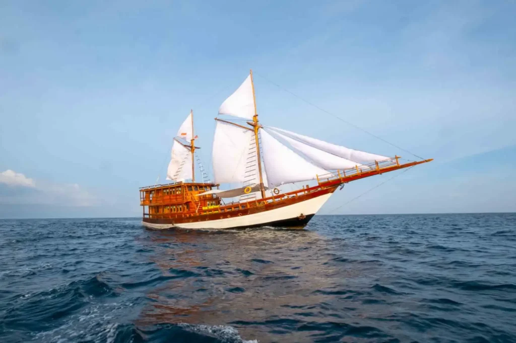 Side profile of Gammara showing the ironwood and gold teak hull