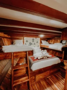 Side view of the Yudhistira family cabin beds aboard Gandiva Phinisi