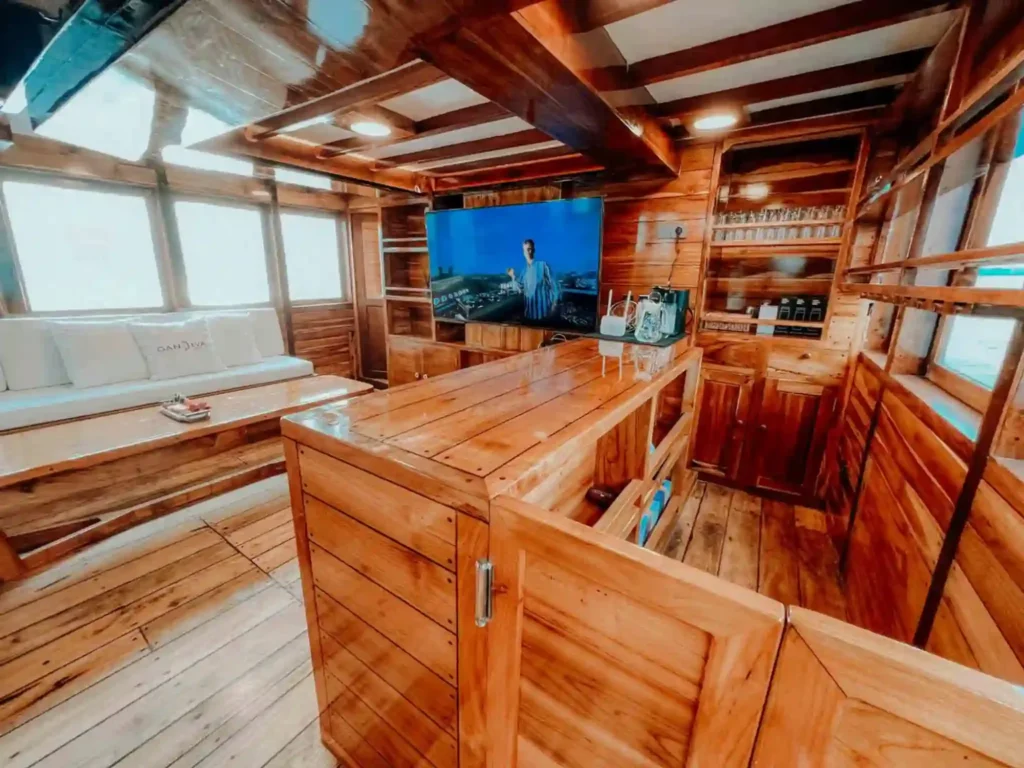 Indoor lounge and bar aboard Gandiva Phinisi