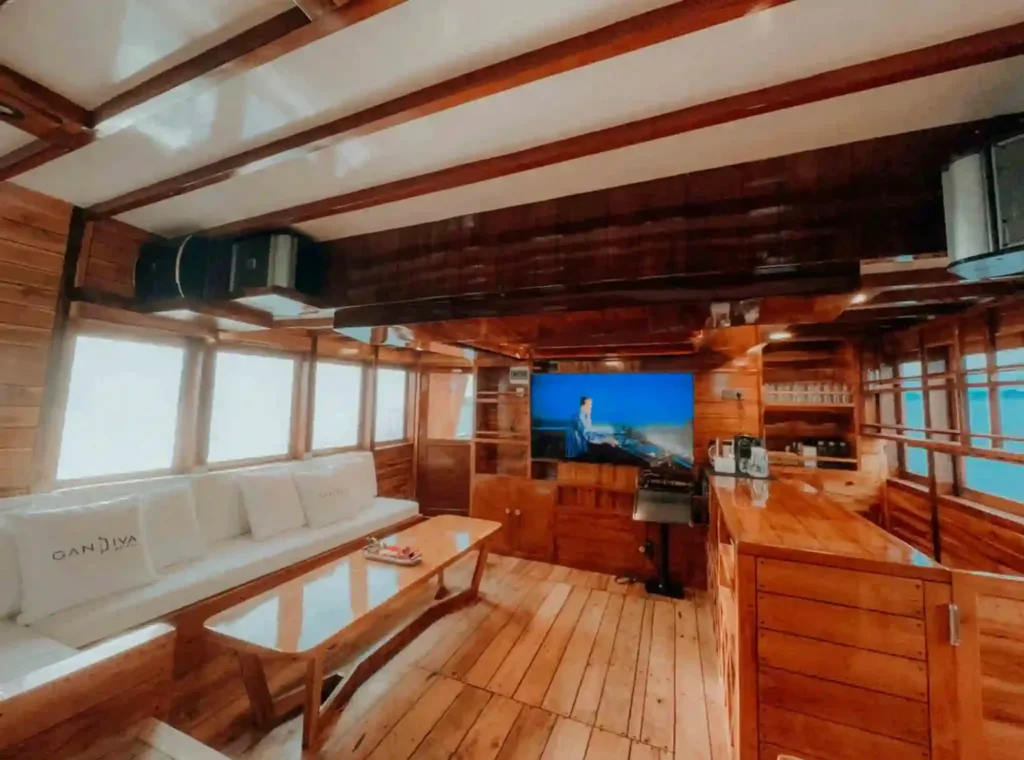 Indoor lounge and television aboard Gandiva Phinisi