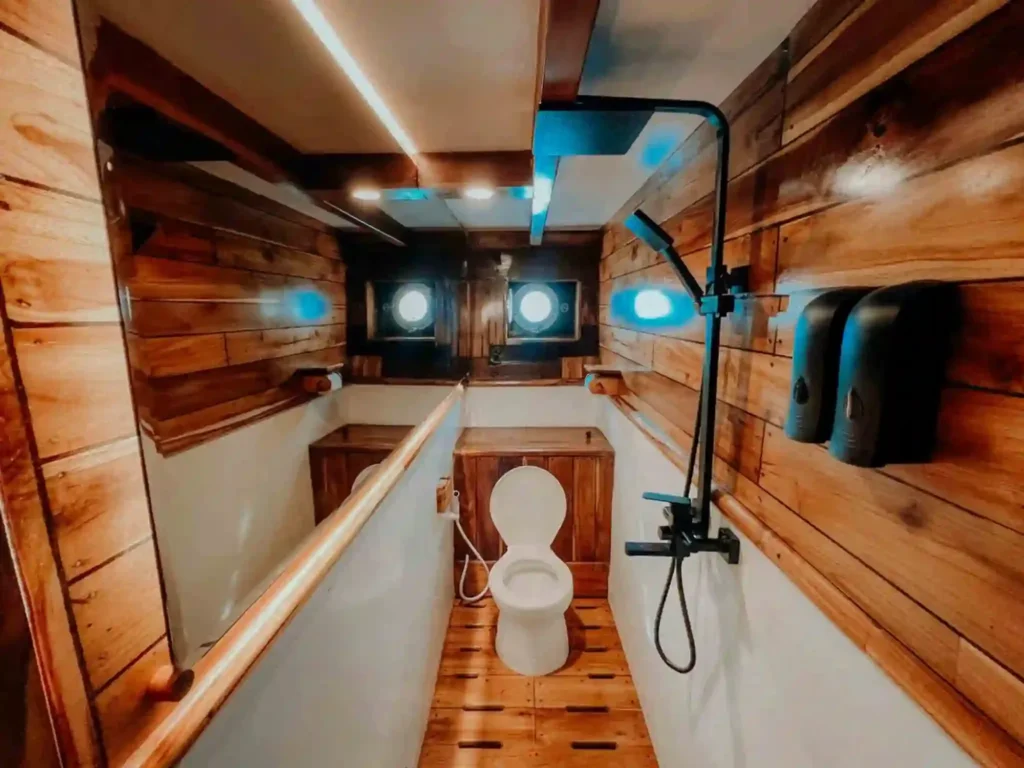 Lounge area on Gandiva with flat-screen TV and karaoke