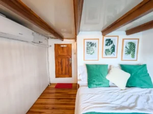 Deluxe cabin aboard Hatira Hela with queen bed and ocean view
