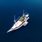 Ikan Kayu phinisi yacht from the air in Komodo National Park