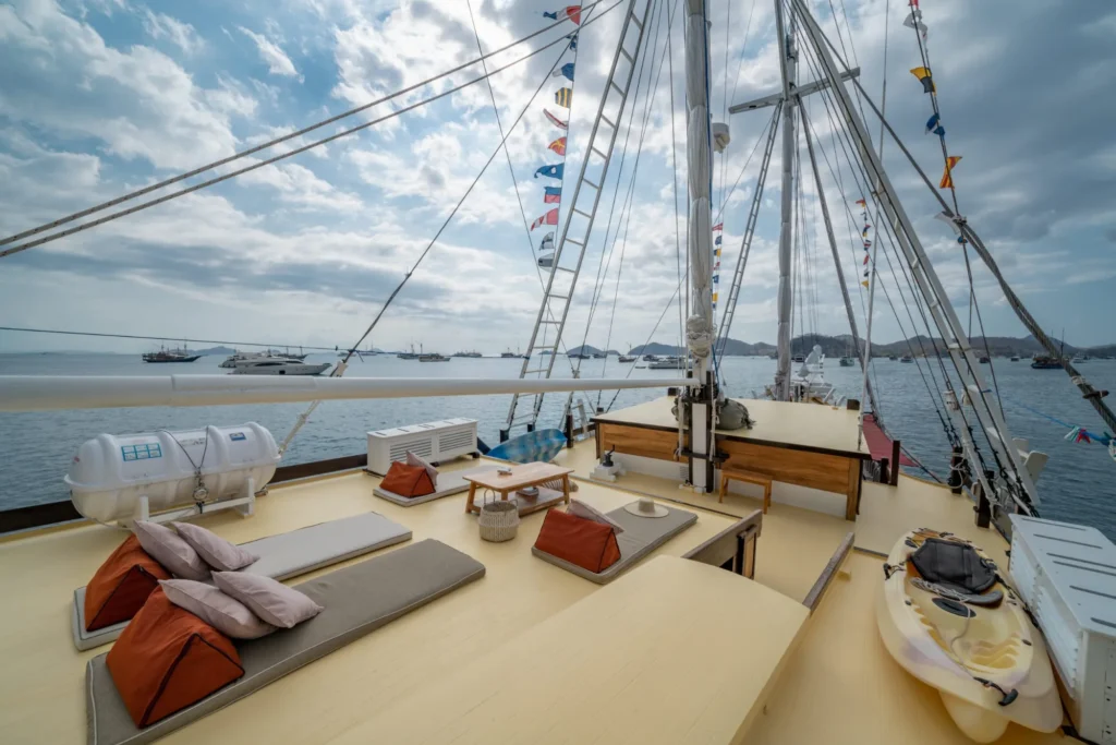 Rear deck rest area on Jakare with cushions and open sightlines to the water