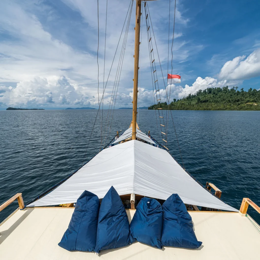 Bow lounge with cushions aboard Jaya in Raja Ampat