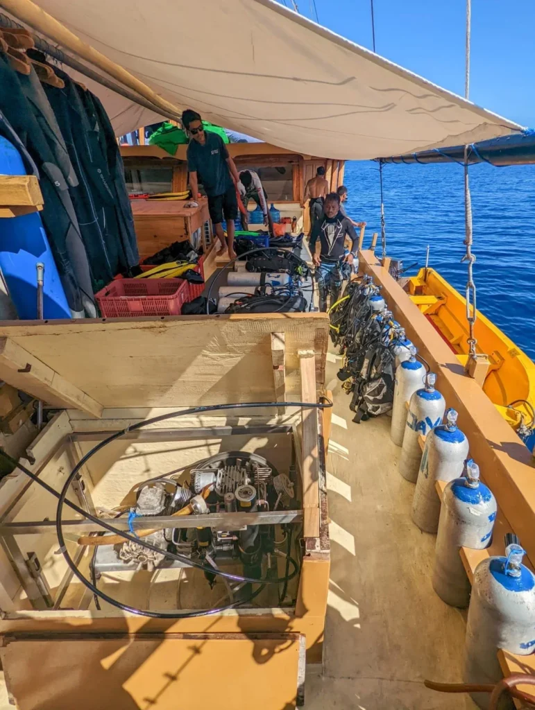 Divers preparing equipment on the dive deck of Jaya