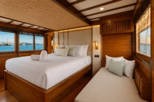 Bedding and cabin detail in the Junior Suite Stateroom on KAI Voyage