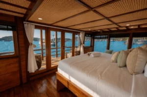 Signature Stateroom bedding and cabin detail aboard KAI Voyage
