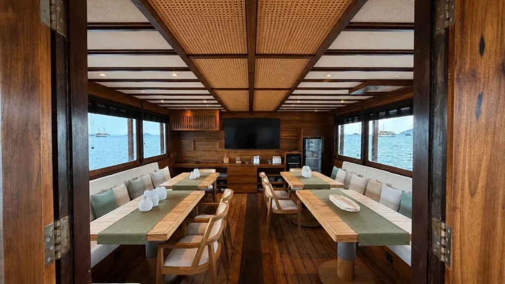 Dining table and seating area aboard the KAI Voyage phinisi
